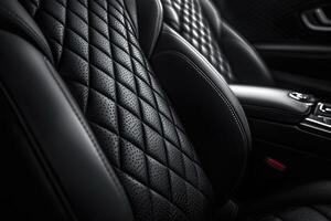 Empty black leather car seat with a diamond pattern stitching photo