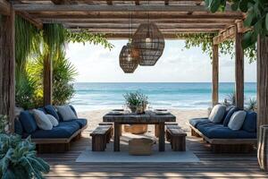 Luxurious beachfront patio featuring dining area and comfortable seating photo