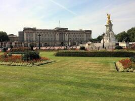 A view of Buckingham Palace in London in July 2023 showing the flowers in front photo