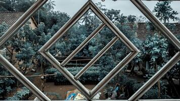A view of a window with a diamond pattern photo