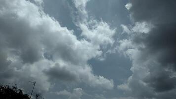 A plane flying in the sky with clouds photo