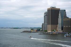 View from the Brooklyn Bridge towards the Statue of Liberty. photo
