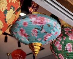 Beautiful decorative chinese lanterns with floral pattern isolated on horizontal ratio background. photo
