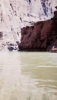A serene lake nestled among towering cliffs video