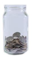 A clear glass jar filled with coins of various sizes and designs stands out against a crisp white background. Financial concept of accumulation and investment. video