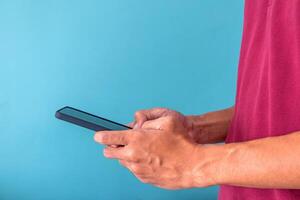 A man uses a mobile phone for work, search for information or use social media applications photo