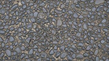 Grey rock stone texture background wall pattern, top view. Background design for dark wallpaper photo