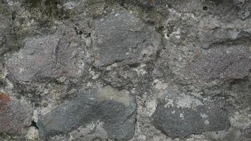 Grey rock stone texture background wall pattern, top view. Background design for dark wallpaper photo