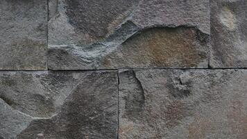 Grey rock stone texture background wall pattern, top view. Background design for dark wallpaper. photo