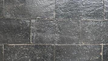 Grey rock stone texture background wall pattern, top view. Background design for dark wallpaper. photo