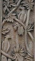 Marble stone carving with geometric, plant and bird motifs. Handmade. marble texture. nusantara motifs in the decoration of Orthodox churches. photo