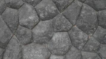 Grey rock stone texture background wall pattern, top view. Background design for dark wallpaper. photo