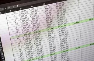 Shot of an dark mode excel sheet on computer screen showing bank loan amortization table. Banking photo