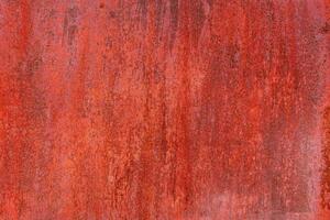 rusty red painted flat sheet metal surface full-frame background and texture photo