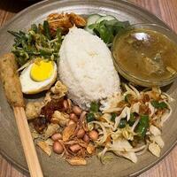 Transporting my taste buds to Bali with a plate of nasi Bali. Bursting with flavors and a perfect mix of spices pure paradise on a plate photo