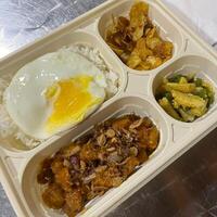 Embark on a flavor journey with our Indonesian bento box, an irresistible mix of vibrant tastes and traditional delights in every bite photo
