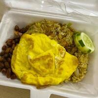 Diving into the bold flavors of Indonesia fried rice, Nasi Goreng Aceh. A spicy twist that is simply irresistible photo