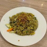 Savoring the bold flavors of Nasi Goreng Teri Cabe Hijau. Spicy, savory, and simply addictive. photo