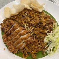 Slurping up these delicious kwetiau noodles. A perfect blend of flavors and textures in every bite photo