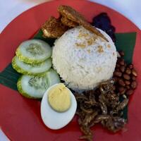 Embracing the deliciousness of nasi lemak, coconut rice, sambal, and all the fixings. A true Malaysian classic photo