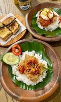 Spicy, crispy, and oh so satisfying. Nasi ayam geprek is the ultimate comfort food that never disappoints. photo