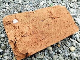 Handmade Clay Bricks with Earthy Texture Placed on Gravel Path photo