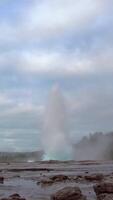 Geysir destrict in Iceland. The Strokkur Geyser erupting at the Haukadalur geothermal area, part of the golden circle route, in Iceland. Vertical footage video