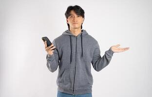 Portrait of asian man wearing hoodie posing on white background photo