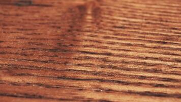 A sliding footage of a beautiful brown wooden surface texture. Can be used as background. 4k video
