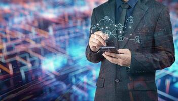 Businessman using smartphone with social network icons on background photo