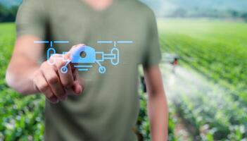 Man pointing drone on field photo