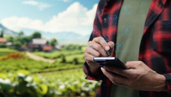 A man is using his cell phone in a field photo