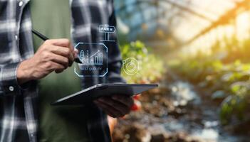 Man using tablet to draw on screen with digital data photo