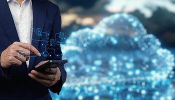 Businessman using smartphone with cloud computing concept photo