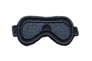 A detailed embroidered patch of protective eyewear, ideal for customization on clothing or accessories. High-quality design with intricate stitching. png