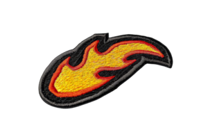 Colorful flame embroidered patch with red, yellow, and black threads. Ideal for customizing jackets, bags, and other fabrics. Isolated on transparent background. png