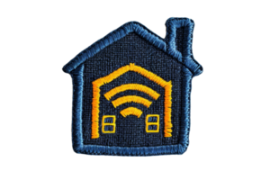 Embroidered patch featuring a house with a Wi-Fi symbol, representing smart home technology, on a transparent background. png