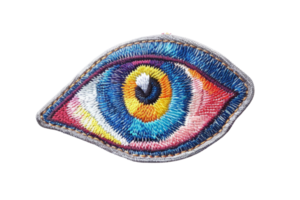 Colorful embroidered eye patch with intricate design, perfect for adding a unique touch to clothing and accessories. Stock photo. png
