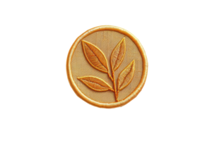 Golden embroidered leaf design emblem on a circular patch, symbolizing nature and elegance in a simple, stylish icon. png