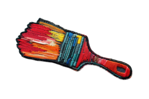 Close-up of a colorful embroidered paintbrush with vibrant threads and intricate stitching, isolated on a transparent background. png