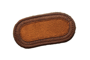 Brown leather patch isolated on a transparent background. perfect for sewing and crafting projects, offering a rustic and durable design. png