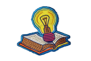 Colorful patch featuring an open book with a glowing light bulb, symbolizing knowledge and creative ideas. png