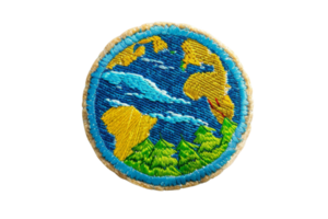 Colorful embroidered patch featuring a world design with continents and oceans, symbolizing global unity and environmental awareness png