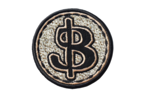 Close-up image of a black and silver embroidered Bitcoin symbol patch isolated on a transparent background. png