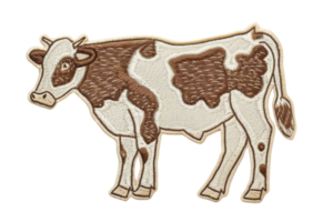 Embroidered patch of a brown and white cow, ideal for DIY projects, clothing, and accessories. Adds a rustic touch to fabric items. png