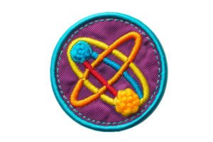 Colorful embroidered science badge featuring an atomic symbol with vibrant colors on a circular patch background. png