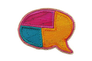 Colorful embroidered patch in the shape of a speech bubble with distinct sections for creative designs and fashion decoration. png