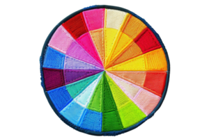Circular embroidery with colorful segments creating a vibrant pattern, showcasing various shades and hues for creative projects. png
