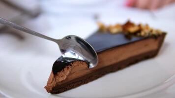 chocolate tart Biting a delicious piece of chocolate cake.Eating chocolate cake. Taking a bite of moist delicious chocolate cake with a fork video