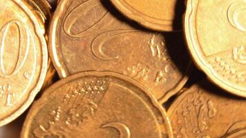 Scattered 20 Euro Cent Coins, Rotating Money Background - Top View, Macro. Euro Money Currency. A Lot of Twenty Cent Cash. Business, Finances and Money Saving Concept - Rotation Right video